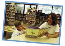 Picture of child reading in a library